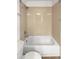 Bathroom featuring a white tiled shower-tub combination with neutral tile and chrome fixtures at 23559 Branston Ln, Parker, CO 80138