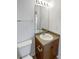 Bathroom vanity has a single sink, a medium wood cabinet, and chrome hardware at 23559 Branston Ln, Parker, CO 80138