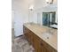 Stylish bathroom with double vanity, granite countertops, and a glass-enclosed shower at 23559 Branston Ln, Parker, CO 80138