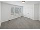 Bright bedroom with ample natural light, neutral decor, and a spacious closet at 23559 Branston Ln, Parker, CO 80138
