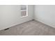 Bedroom with gray carpet and a window with blinds at 23559 Branston Ln, Parker, CO 80138
