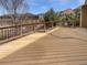 Spacious deck with wood railing is great for entertaining and outdoor relaxation at 23559 Branston Ln, Parker, CO 80138
