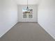 Elegant dining room with soft carpet and modern chandelier for a sophisticated look at 23559 Branston Ln, Parker, CO 80138