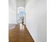 Welcoming foyer with hardwood floors and an elegant light fixture at 23559 Branston Ln, Parker, CO 80138
