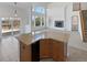 Modern kitchen with granite countertops, stainless steel appliances, and access to a deck at 23559 Branston Ln, Parker, CO 80138