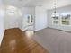 Bright living room with hardwood floors, carpet, and a modern chandelier at 23559 Branston Ln, Parker, CO 80138