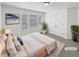 Serene main bedroom featuring ample natural light, neutral decor, and a spacious closet at 23559 Branston Ln, Parker, CO 80138
