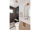 Modern bathroom with dark tile and a glass shower at 3437 W 17Th Ave, Denver, CO 80204