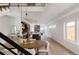 Open concept dining area with wood floors, and modern light fixtures at 3437 W 17Th Ave, Denver, CO 80204