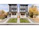 Modern two-story townhouses with light brick exterior, dark accents, and a landscaped yard at 3437 W 17Th Ave, Denver, CO 80204