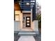 Modern front entrance with a black door, light brick exterior, and a minimalist design at 3437 W 17Th Ave, Denver, CO 80204