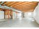 Unfinished basement with exposed ceiling, concrete floor, and framed stairwell awaiting customization at 13915 Ivanhoe St, Thornton, CO 80602