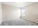 Neutral bedroom with natural light, carpet, and a street view, creates a cozy space at 13915 Ivanhoe St, Thornton, CO 80602