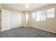 Inviting bedroom featuring a ceiling fan, closet, and window, offering a cozy retreat at 13915 Ivanhoe St, Thornton, CO 80602