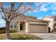 Charming exterior featuring a two-car garage, well-maintained lawn, and a welcoming entrance at 13915 Ivanhoe St, Thornton, CO 80602