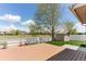 Backyard with a deck, lawn, storage shed, and a white fence at 13244 Quivas St, Denver, CO 80234