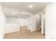 Finished basement area with neutral paint, carpet, and lighting at 13244 Quivas St, Denver, CO 80234