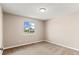 Bedroom with carpet, window, and baseboard trim at 13244 Quivas St, Denver, CO 80234