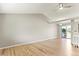 Vaulted ceiling in the living room with light wood floors and neutral paint and a ceiling fan at 13244 Quivas St, Denver, CO 80234