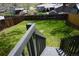 Manicured backyard with green grass and wood fence at 8832 Lipan St, Thornton, CO 80260