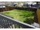Large, grassy backyard with wooden fence providing privacy and a safe outdoor space for recreation at 8832 Lipan St, Thornton, CO 80260