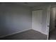 Bedroom featuring new carpet, closet with sliding doors, painted with a light grey color at 8832 Lipan St, Thornton, CO 80260