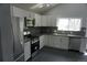 Kitchen with stainless steel appliances, granite countertops and white cabinets at 8832 Lipan St, Thornton, CO 80260