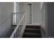 Carpeted staircase with white wood railing leading to the upper level at 8832 Lipan St, Thornton, CO 80260