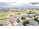Expansive aerial view of home and surrounding neighborhood with a park and walking trails nearby at 446 Angus Way, Highlands Ranch, CO 80129