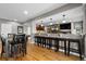 View of the open-concept bar area connecting the dining and living spaces in this home at 446 Angus Way, Highlands Ranch, CO 80129