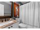 Cozy bathroom with granite countertops, decorative mirror, and a shower with a curtain at 446 Angus Way, Highlands Ranch, CO 80129