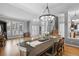 Spacious dining area with hardwood floors, an elegant chandelier, and natural light at 446 Angus Way, Highlands Ranch, CO 80129