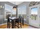 Cozy dining nook with a view of the outdoors, featuring a door to the outside at 446 Angus Way, Highlands Ranch, CO 80129