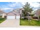 Stunning brick two-story home with a well-manicured lawn and a three car garage on a sunny day at 446 Angus Way, Highlands Ranch, CO 80129