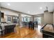 Spacious game room with a bar area, fireplace, and doors leading to a manicured outdoor space at 446 Angus Way, Highlands Ranch, CO 80129