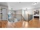 Upstairs hallway with hardwood floors, iron railings, and contemporary chandeliers at 446 Angus Way, Highlands Ranch, CO 80129