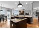 Gourmet kitchen with a granite island cooktop and lots of natural light and backyard access at 446 Angus Way, Highlands Ranch, CO 80129