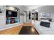 Spacious living room with hardwood floors and a built-in entertainment center in a neutral decor at 446 Angus Way, Highlands Ranch, CO 80129