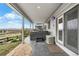 A covered patio features a hot tub, flagstone, and access to the main house at 446 Angus Way, Highlands Ranch, CO 80129