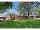 Spacious backyard featuring a well-maintained lawn, a wood fence, and a chicken coop at 1089 E 131St Dr, Thornton, CO 80241
