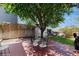 Tranquil backyard featuring a brick patio, mature trees, and an outdoor dining area for al fresco meals at 1089 E 131St Dr, Thornton, CO 80241