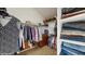 Spacious walk-in closet with ample storage shelves and hanging racks for organized clothing storage at 1089 E 131St Dr, Thornton, CO 80241