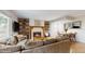 Bright living room featuring a fireplace, wooden floors and comfortable seating at 1089 E 131St Dr, Thornton, CO 80241