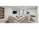 Spacious living room with a sectional sofa, bookshelves, and entertainment area at 1089 E 131St Dr, Thornton, CO 80241
