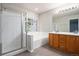 Bathroom featuring a separate shower, soaking tub, and a dual sink vanity at 2786 S Cathay Way, Aurora, CO 80013