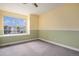 Bright, carpeted bedroom with fresh paint and a large window at 2786 S Cathay Way, Aurora, CO 80013