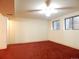 Finished basement with carpet and windows at 2624 S Carson Way, Aurora, CO 80014