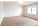 Bright bedroom with carpet flooring and large window at 2624 S Carson Way, Aurora, CO 80014