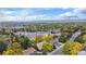 Aerial view of a neighborhood showcasing lush greenery and mountain views at 5720 E Caley Ave, Centennial, CO 80111