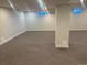 An unfinished basement with neutral walls, a support column, recessed lighting, and carpet at 5720 E Caley Ave, Centennial, CO 80111